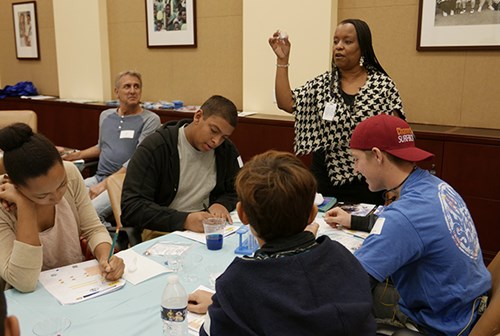 A teacher guiding a lesson about water for teenagers