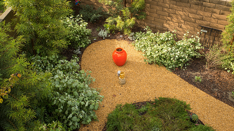 Conservation Garden with orange pot at the center