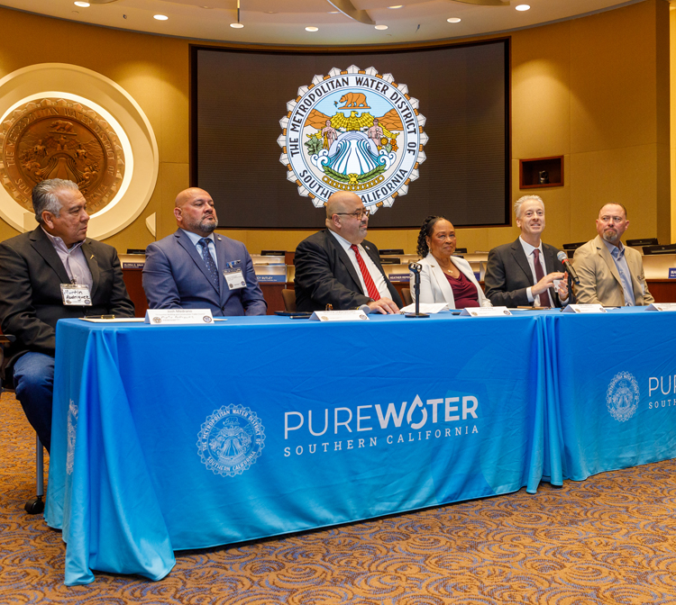Photo of signing agreement.