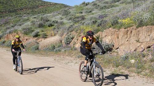 Two people cycling on a trail at Diamond Valley Lake