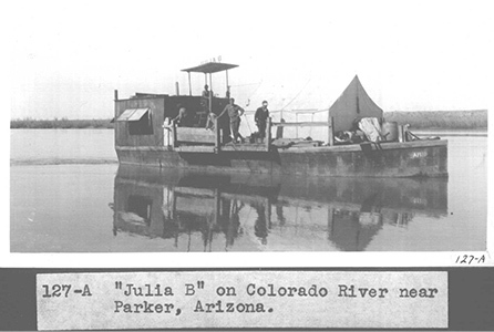 The Julia B on the Colorado River, near Parker, AZ with LA city surveyors, 1931.